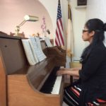 Playing the piano for the Japanese church